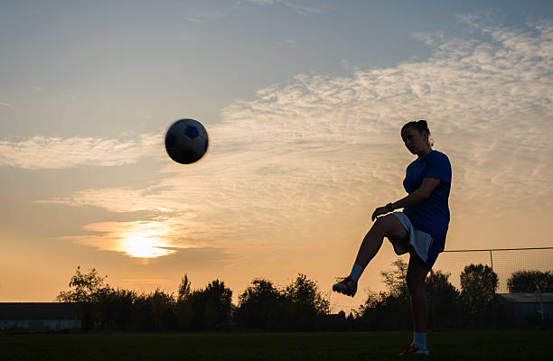 women's soccer girl kicking soccer ball womens soccer stock pictures, royalty-free photos & images