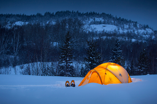 Winter camping under the tent, Quebec, Canada