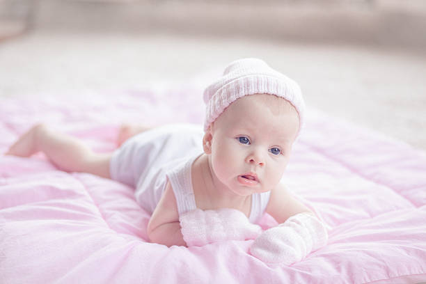 istock Grumpy baby girl lying at her stomach 531211139