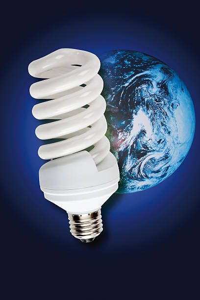 istock Energy saving lamp, image of earth in background, (digital composite) 531212109