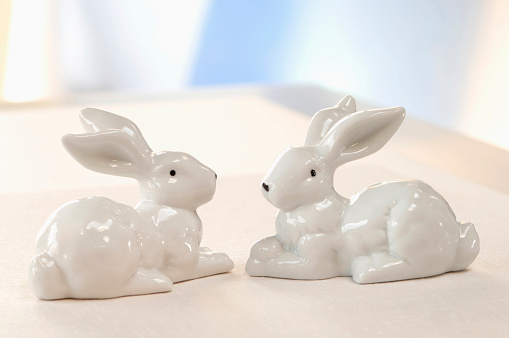 Two ceramic bunnies, close-up