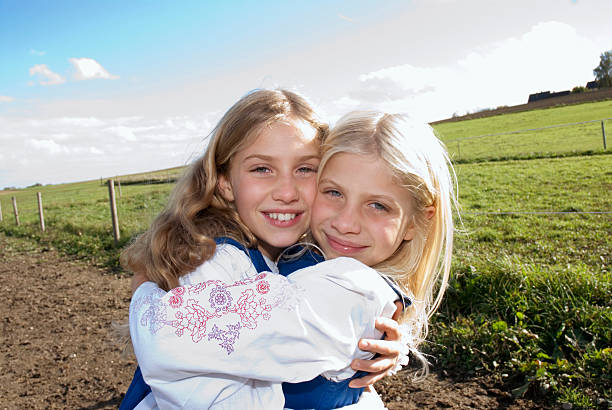 istock Two girls embracing, portrait 531213193