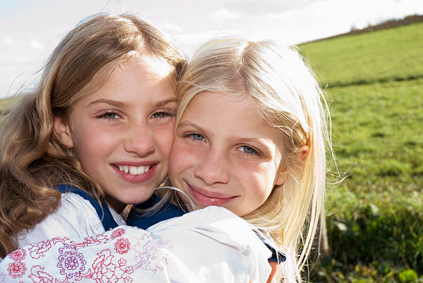 istock Two girls embracing, portrait 531213201