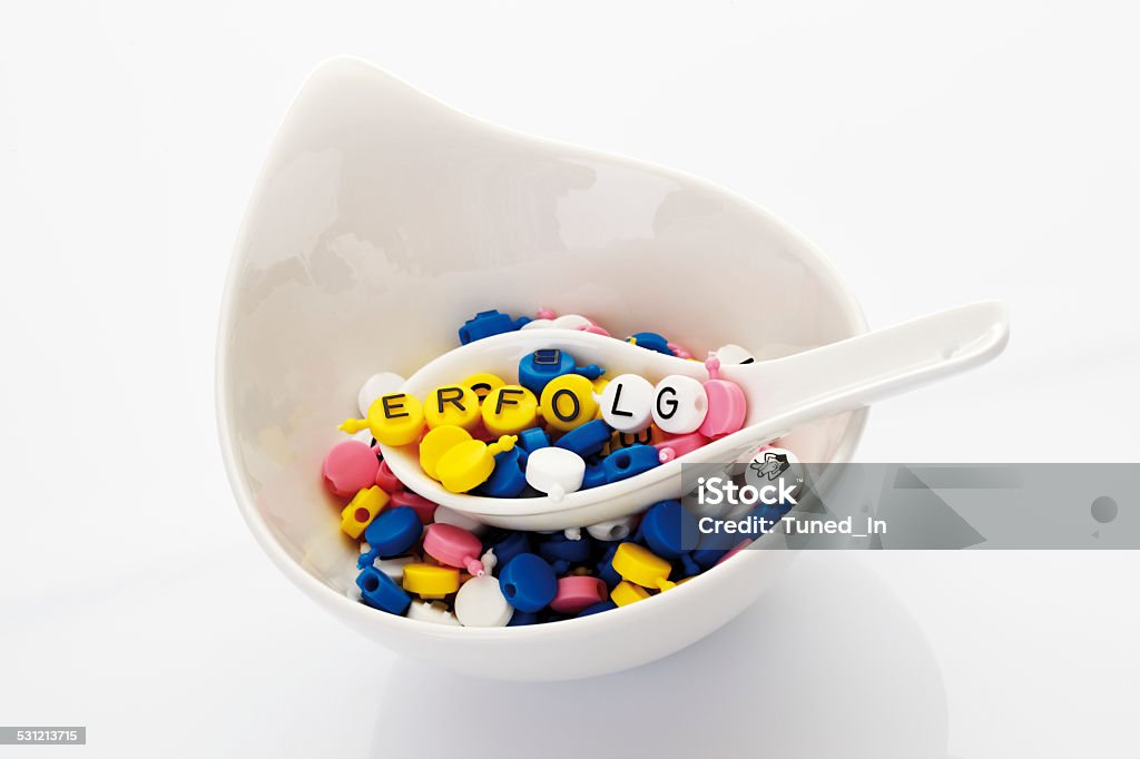 Letters on spoon in soup bowl forming the word success 2015 Stock Photo