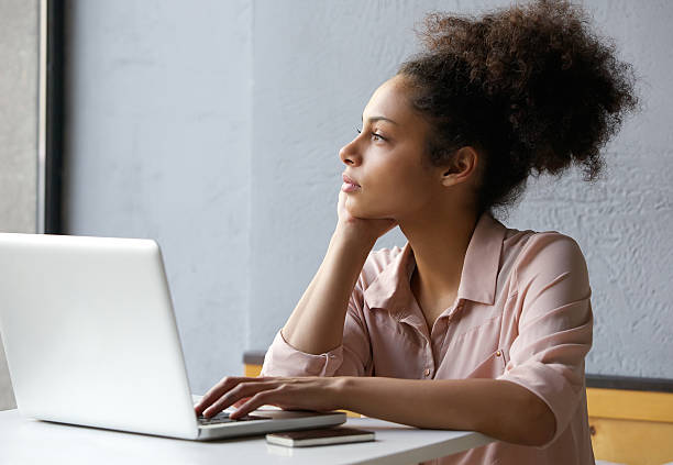 istock Young working woman looking out window 531224655