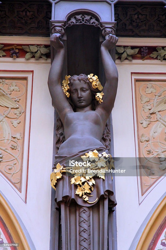 Strong and Stoic A caryatid in Vienna. The caryatid is part of the of the ornate Ferstel passage, a covered walkway, in Vienna, designed by Heinrich von Ferstel in 1860. 2015 Stock Photo