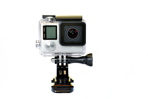 Action camera. Isolated against a white background. this is a minature action camera. the camera is used for high quality videos and photographs of extreme sports. snorkeling Skeeing rafting sky diving etc.