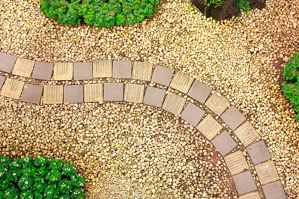 istock Stone walkway in the park with green grass 531229063