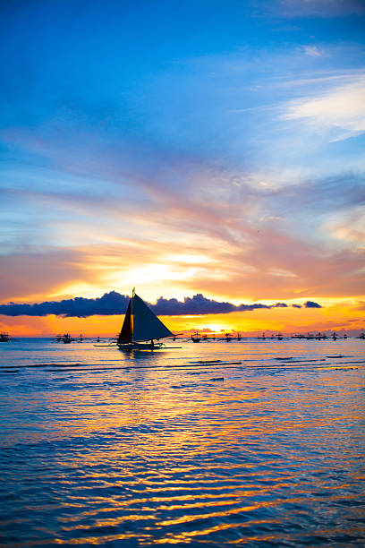 Sailing boat in awesome sunset in Boracay island on Philippines