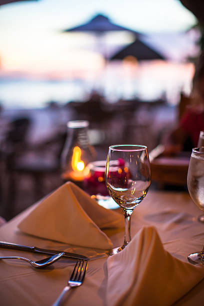 istock Closeup empty wine glass on the set table at sunset 531229429