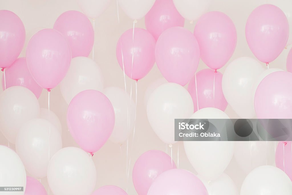 Balloons White and pink balloons on a light background. Birthday greetings. Greeting card. Balloon Stock Photo