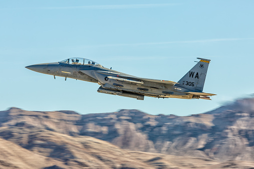 Las Vegas, USA - November 8, 2014: F-15 Eagle performs flyby during Aviation Nation airshow at Nellis AFB on November 8,2014 in Las Vegas,NV. F-15 is a tactical fighter. It was designed by McDonnell Douglas. 