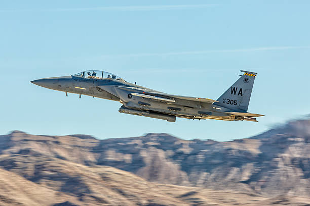 F-15 Eagle performs flyby during Aviation Nation at Nellis AFB Las Vegas, USA - November 8, 2014: F-15 Eagle performs flyby during Aviation Nation airshow at Nellis AFB on November 8,2014 in Las Vegas,NV. F-15 is a tactical fighter. It was designed by McDonnell Douglas.  supersonic airplane editorial airplane air vehicle stock pictures, royalty-free photos & images