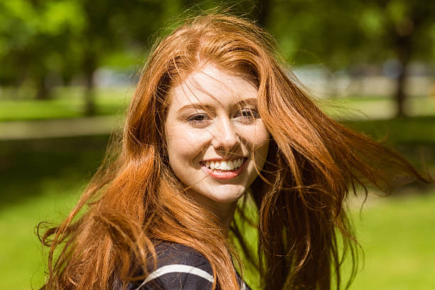 istock Beautiful young woman in park 531236667