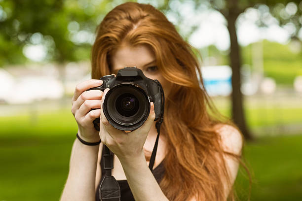 istock Female photographer at park 531236741