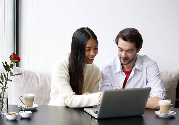 istock Young couple looking at laptop 531237049