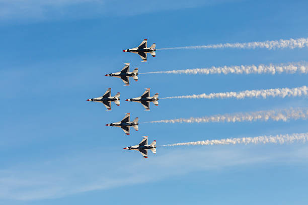 USAF Thunderbirds perform air show routine Las Vegas, USA - November 8, 2014: USAF Thunderbirds perform air show routine during Aviation Nation at Nellis AFB on November 8,2014 in Las Vegas,NV. Squadron is the official air demonstration team for the USAF. supersonic airplane editorial airplane air vehicle stock pictures, royalty-free photos & images