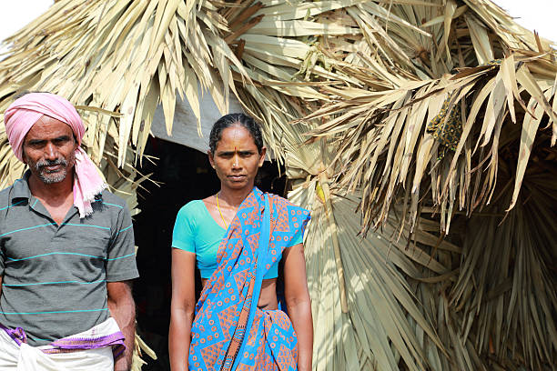 Nomadic Life Srikakulam, Andhra Pradesh, India - December 15, 2014: Narayana and his wife who survived from the clutches of cyclone leading a nomadic life. south indian lady stock pictures, royalty-free photos & images