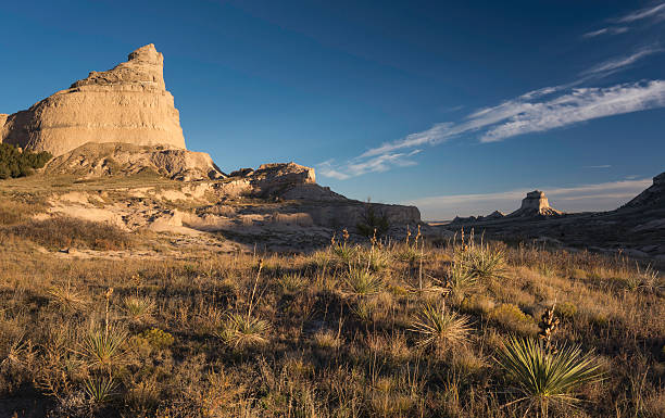 Scotts Bluff National Monument Scotts Bluff National Monument is located in western Nebraska.  Looking east is Eagle Rock which was used as a landmark to the early pioneers on there way west. Mitchell pass is where the Oregon Trail crosses between Eagle Rock and Sentinel Rock.  eagle rock stock pictures, royalty-free photos & images