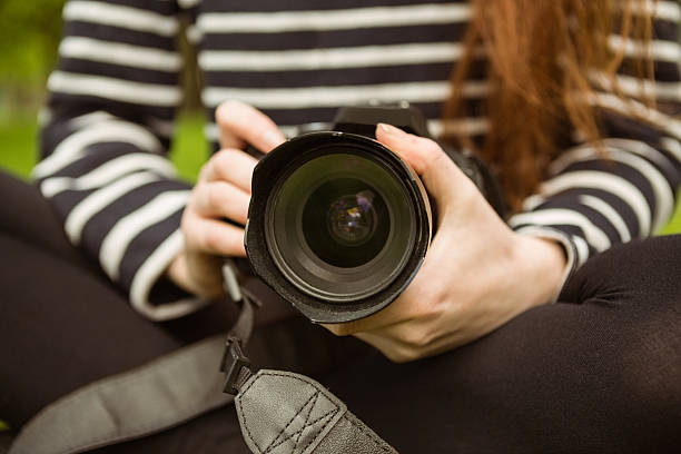 istock Mid section of female photographer 531238929