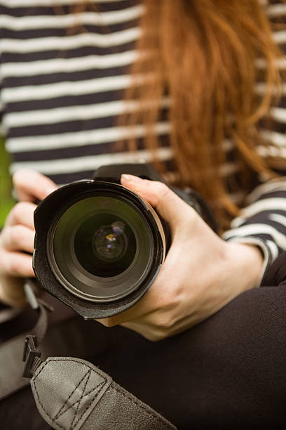 istock Mid section of female photographer 531238937