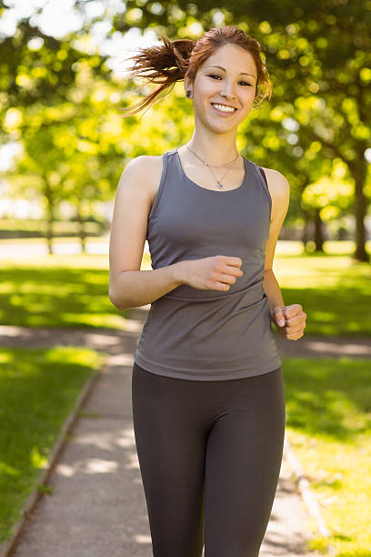istock Portrait of a pretty redhead running 531240823
