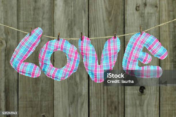 Pink And Blue Love Text Hanging On Clothesline Stock Photo - Download Image Now - 2015, Anniversary, Antique