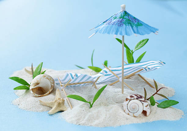 Travel vacation concept - sand island beach with sunbeds