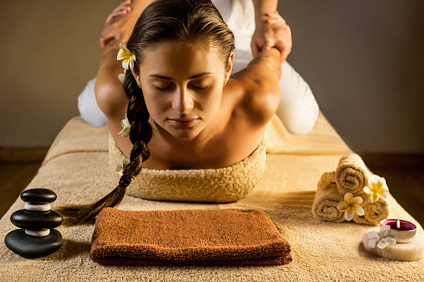 Thai massage The beautiful girl has massage. Stretching. apocynaceae stock pictures, royalty-free photos & images