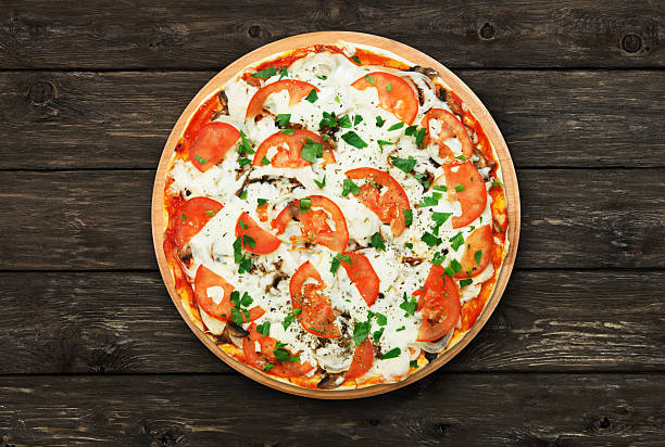 istock Delicious pizza with mushrooms and meat 531243414