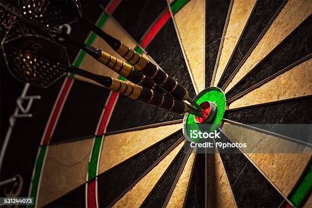 Three Darts In Bulls Eye Close Up Stock Photo - Download Image Now - Darts, Dart, Throwing