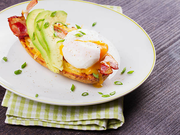 istock Stuffed potato with bacon, poached egg and avocado 531247368
