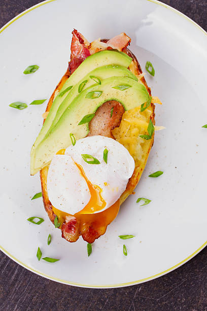istock Stuffed potato with bacon, poached egg and avocado 531247496