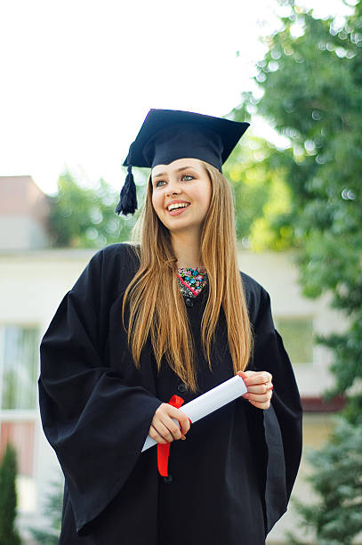 istock Young girl happily clutching a scroll 531247714