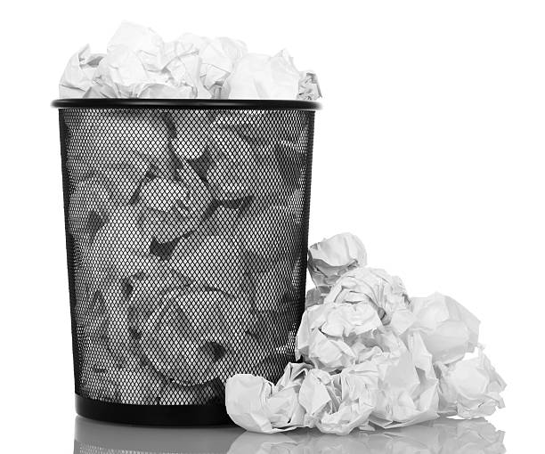 istock Basket overflowing with office paper isolated 531248092