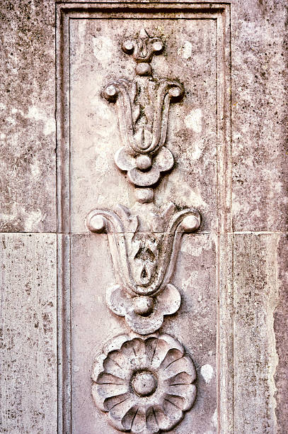 istock Ornamental floral curves on stone wall. 531250815