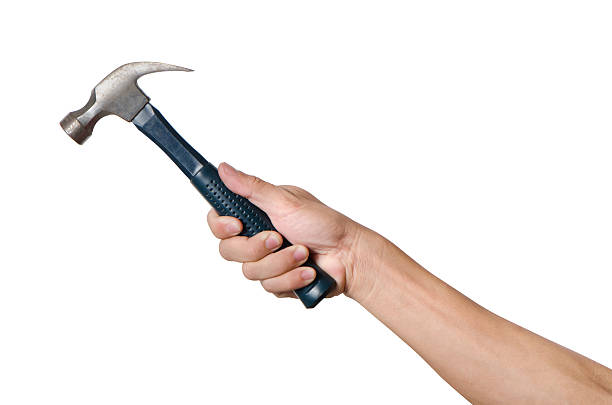 istock Men is holding a hammer isolated on white background 531251640