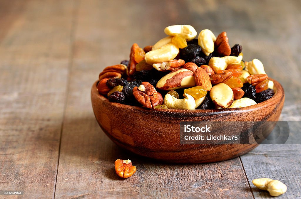 Dried fruits and nuts mix. Dried fruits and nuts mix in a wooden bowl. 2015 Stock Photo