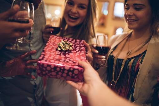 A group of friends drinking wine and having a good time