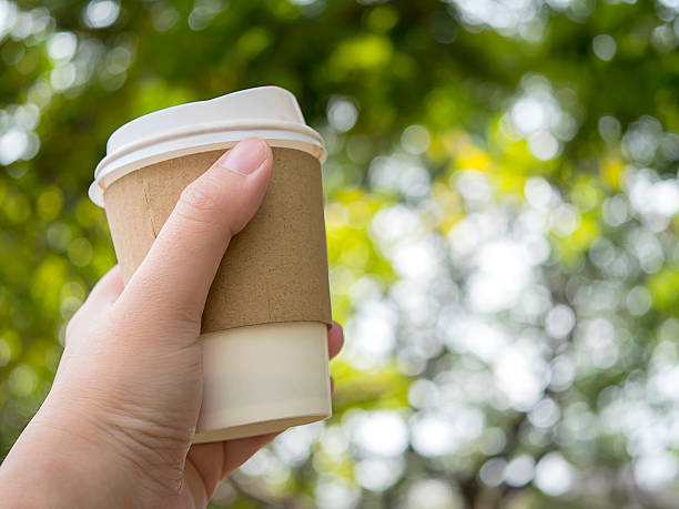 istock Hold hot paper cup of coffee 1 531255840