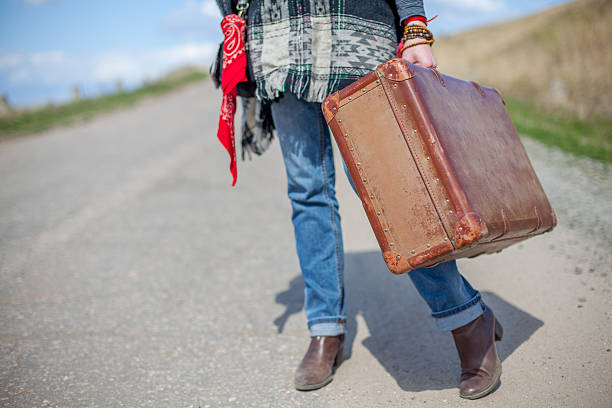 istock old brown suitcase stands on a desert road 531256252