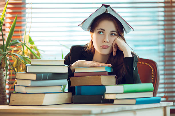 istock Girl among books 531256334
