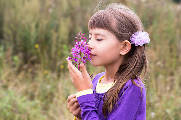 istock Ten-year-old girl smelling flower 531257334