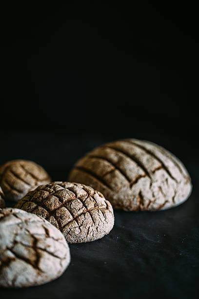 istock black bread on black table close-up. Traditional black rye-bread 531258094
