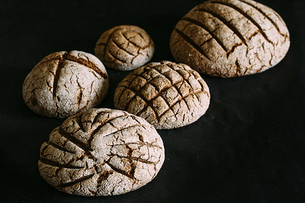 istock black bread on black table close-up. Traditional black rye-bread 531258120