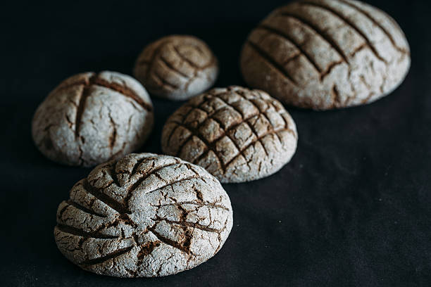 istock black bread on black table close-up. Traditional black rye-bread 531258142