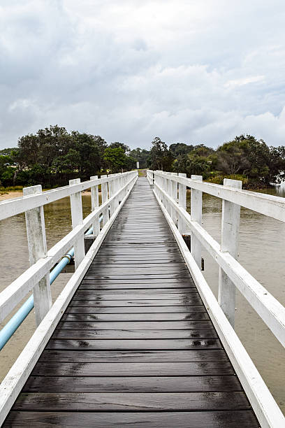 istock Pedestrian bridge crossing on an overcast and drizzly day 531258904