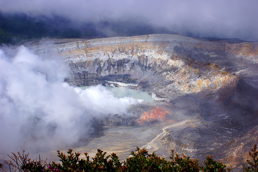 Poas Volcano National Park, Costa Rica. Volcanic steam rises from Laguna Caliente, the active portion of the volcano.