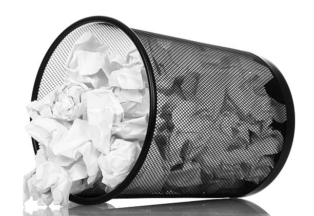 istock Frustrate office basket dropping out o her crumpled paper isolated 531260844