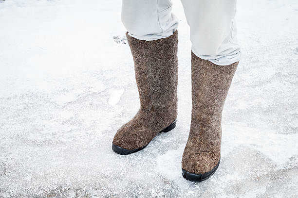 istock Male feet with traditional Russian felt boots 531262467